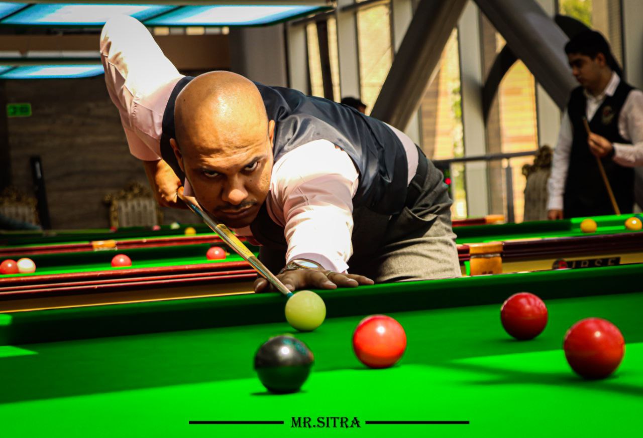 a person playing pool